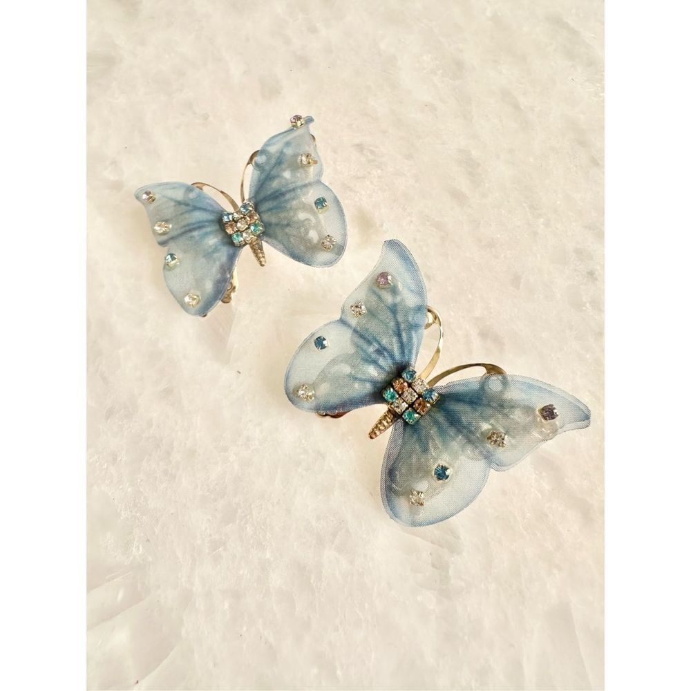 Light blue and rhinestone fluttering butterfly earrings